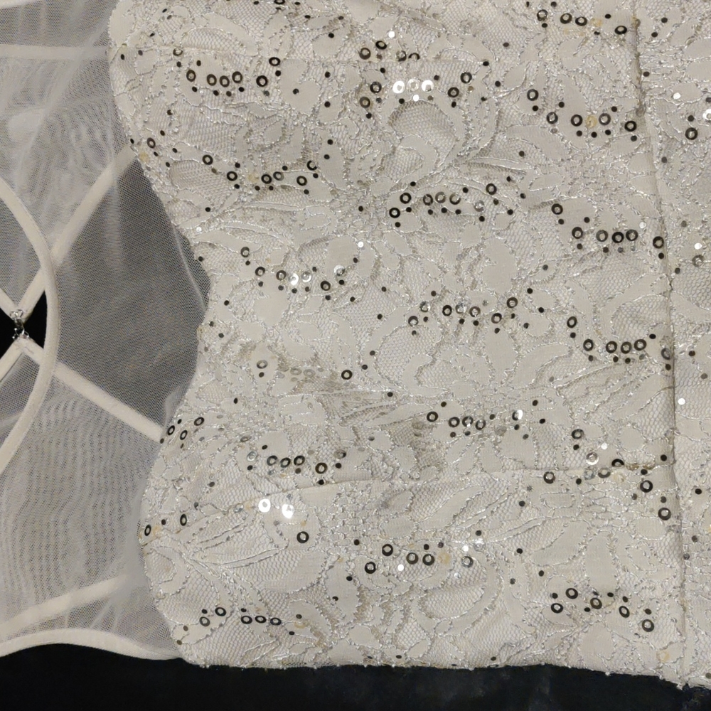 White lace and sequin cocktail dress by City Triangles.